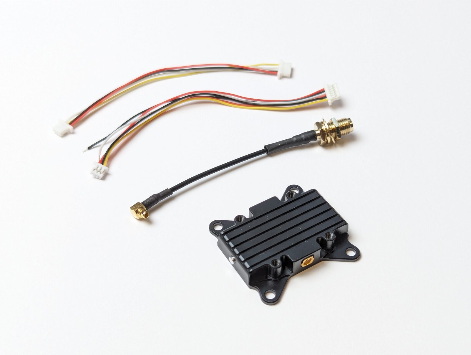 VT5804 package contents — transmitter module, 6-pin ribbon cables, MMCX-to-RPSMA extension feeder cable
