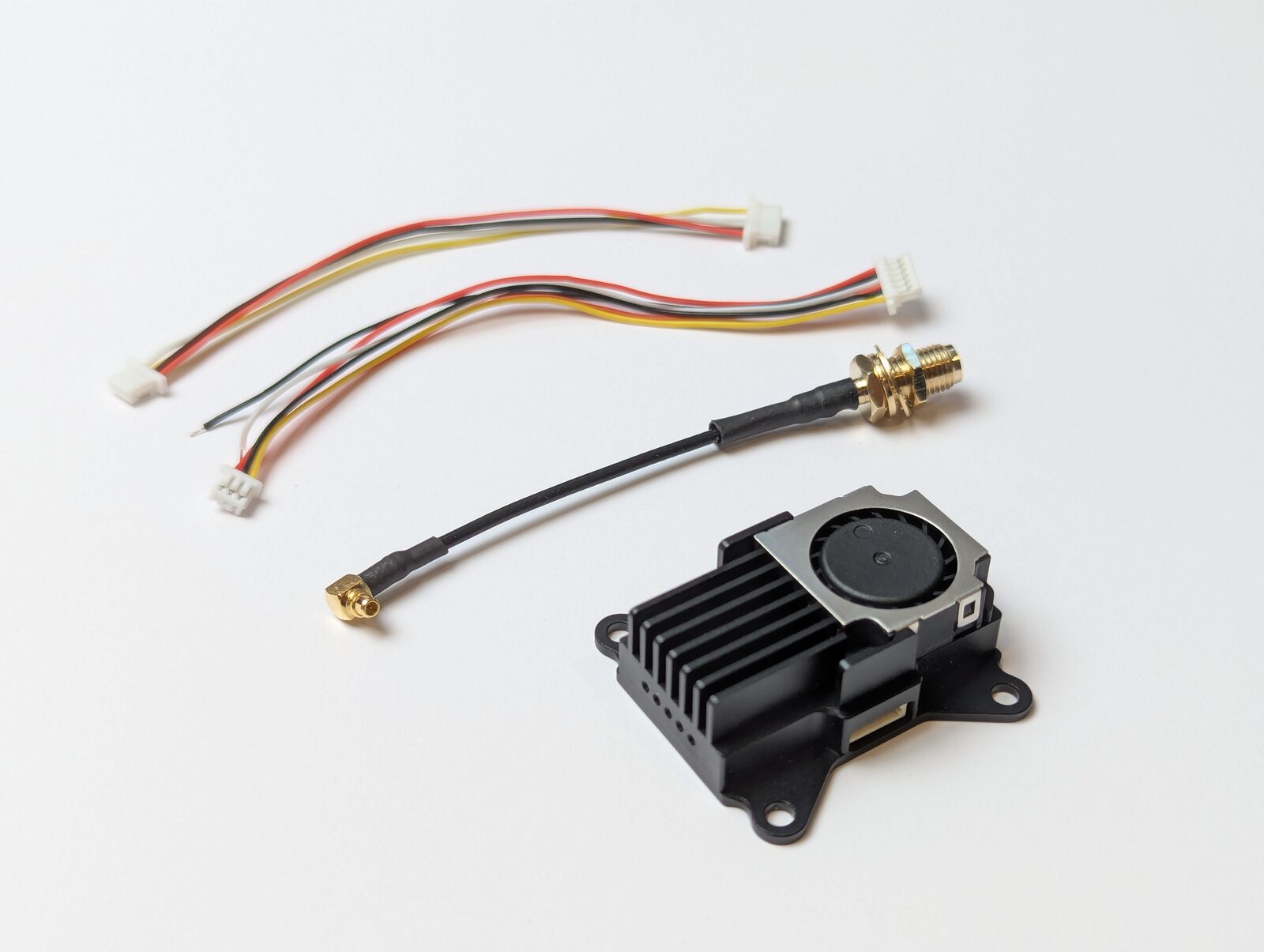 VT5805 package contents — transmitter module with cooling fan, 6-pin ribbon cables, MMCX-to-RPSMA extension feeder cable