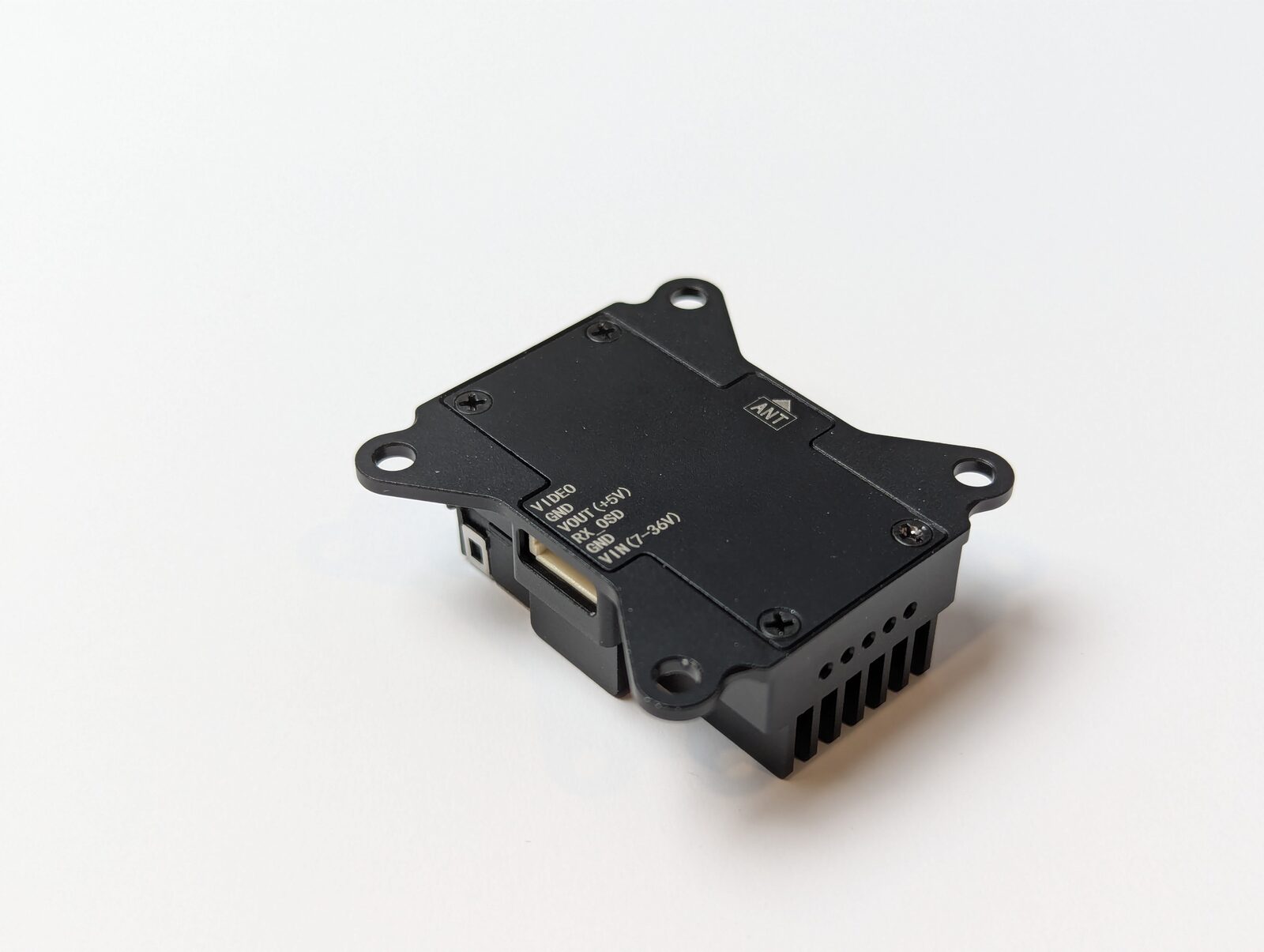 VT5805 case underside — silk-screened pinout labels VIDEO, GND, VOUT +5V, RX_OSD, GND, VIN 7–36V, with ANT direction arrow